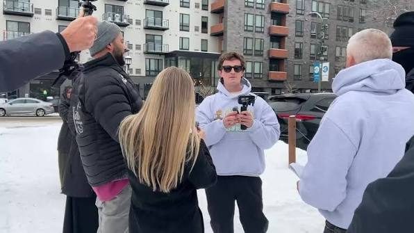 Nick Shirley interviewing people outdoors in the snow in Minneapolis