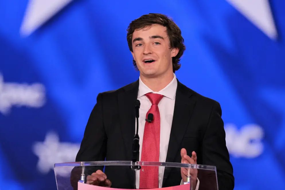 Nick Shirley speaking from a podium