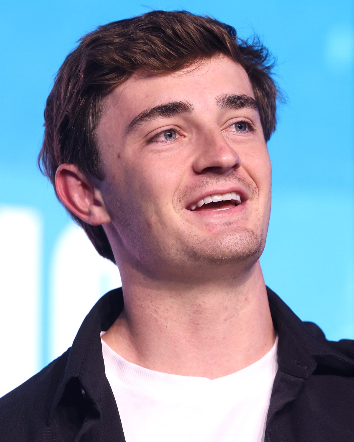 Portrait of Nick Shirley speaking on stage